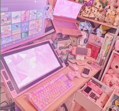 there are many toys and electronic devices on the desks in this room, including an open laptop computer