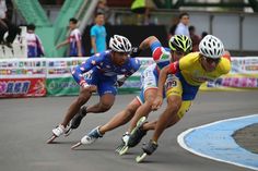 three men racing each other on roller blades