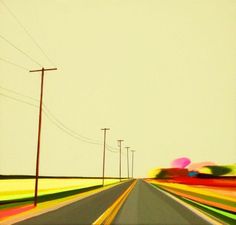 an empty road with power lines and telephone poles