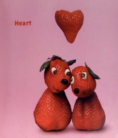 two strawberries with faces on each one and the words heart above them are hearts