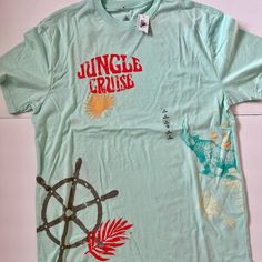 Sea Green Disney Jungle Cruise T-Shirt Size Medium. Brand New With Tags Disney Crew Neck T-shirt For Summer, Disney Themed Short Sleeve T-shirt, Disney Character Print Summer T-shirt, Disney Summer Cartoon Print T-shirt, Disney Themed Short Sleeve Shirt, Themed Cartoon Print Crew Neck T-shirt, Casual Green T-shirt With Character Print, Disney Cotton T-shirt For Disney Fan Events, Themed Short Sleeve T-shirt With Cartoon Print