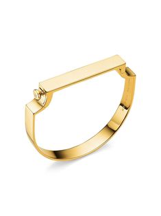 Combining strong clean lines with flowing curves, the handcrafted Signature bangle is both modern and feminine. The simple silhouette fits comfortably around your wrist, with a hinged bar that easily opens and closes with a snap fastener. The standard size bangle measures 54.3mm in height and 61.6mm in width, and is suitable for a wrist size up to 16.5cm/ 6.5” in circumference. The bar measures 46.4mm in length, 8mm in width and 2.5mm in depth. Wear effortlessly alone or stack with the Signature Thin bangle for bold look. Complimentary engraving at any Monica Vinader store, for a layer of personalisation. Every hand-crafted Monica Vinader piece comes with a 5-Year Warranty and lifetime repair service. Monica Vinader Packaging, Monica Vinader Gold Rings, Monica Vinader Signature Bangle, Luxury Gold-plated Bangle With Polished Finish, Monica Vinader Necklace, Signature Bracelet, Simple Silhouette, Monica Vinader, Snap Fasteners