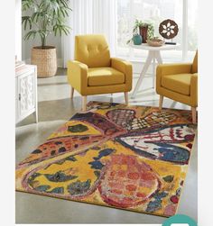 two yellow chairs sitting on top of a rug in a living room next to a window