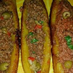 three breaded food items on a yellow plate