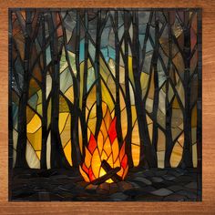 a stained glass window with a campfire in the woods on it's side