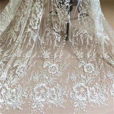 This Stunning Luxury High quality Embroidered Lace Fabric design piece has soft hand feel, ideal for use in DIY craft projects, wedding dress, clothing, party dress, dolls outfits, curtains, shams, lamp shades, headpieces, costumes, accessories, Apparel, handcraft Accessory, cake decor, unity candle, garters, headbands, dance costumes, belly dance costumes. --- THE DETAILS --- This listing is for 1 yard embroidery lace fabric. Wide: about 51inch/130cm Colors: off-white As shown in the picture Ma Veil Dress, White Lace Fabric, Bridal Lace Fabric, Bridal Dresses Lace, Floral Wedding Dress, Embroidered Lace Fabric, Lace Wedding Dress Vintage, Wedding Dress Fabrics, Lace Veils