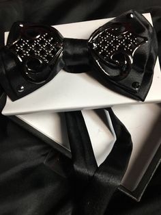 Black satin tie made with love by me. Has an adjustable satin strap. Total must have! Black Standard Tie With Bow, Standard Tie Satin Bow, Adjustable Bow Tie For Black Tie Events, Adjustable Black Bow For Black Tie Events, Adjustable Black Bow With Ties, Adjustable Black Bow Tie, Formal Black Adjustable Bow, Black Adjustable Suit And Tie Accessories With Satin Bow, Satin Bow Ties For Party