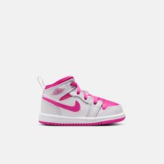 Style No. FD8782-500 Color: White/Iris Whisper/Fire Pink Pick pink for the win! This pair pops to life with a bright mix of rosy hues. All the classic Jordan comforts are there too: foam in the sole for a cushioned step, and that sturdy rubber cupsole for comfort. Jordan 1 Mid Baby/Toddler Shoes. Baby Jordan Shoes, Baby Jordans, White Iris, Kids Jordans, Jordan 1 Mid, Toddler Shoes, Jordan Shoes, Jordan 1