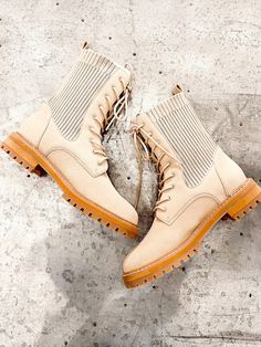 Almond colored combat boot with a sock style. Heel height: 1.25" Shoes are non returnable