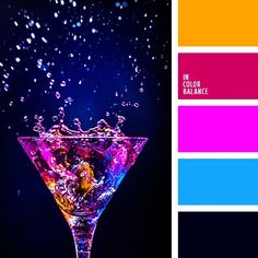 a martini glass with water splashing on it and color swatches in the background