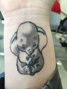 a small elephant tattoo on the wrist