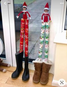 two elfs are standing next to each other in front of a door with their boots on