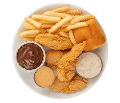 a white plate topped with fried chicken, fries and dipping sauce on top of it