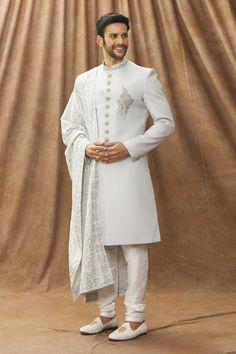 Grey art silk sherwani with placement floral motif and mandarin collar. Comes with churidar and stole.
Component: 3
Type Of Work: Floral pattern
Neckline: Mandarin
Sleeve Type: Full sleeves
Fabric: Sherwani and Stole: Art Silk, Pant: Dupion Art Silk, Lining: Faux Satin
Color: Grey
Other Details: 
Front buttons
Floral motif
Occasion: Destination Wedding - Aza Fashions Grey Sherwani, Stole For Men, Silk Stoles, Grey Art, Satin Color, Fashion App, Churidar, Full Sleeves, Grey Floral