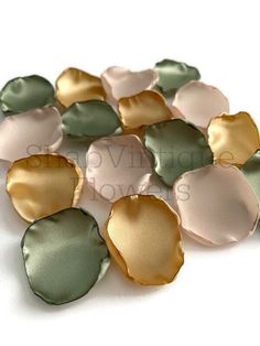 some green and gold shells on a white surface