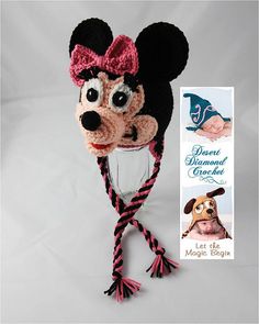 a crocheted mouse hat with a pink bow