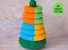 a stack of crocheted toys sitting on top of a wooden table