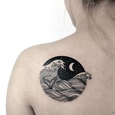 a woman with a tattoo on her upper back shoulder and the moon in the background