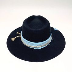 Looking for a stylish and unique felt hat? Look no further than the Coltrane Felt Hat! This stunning hat comes in two colors, black or brown, with a thick blue or light brown corduroy fabric hat band. The crown is 4", brim 3" it also features a thin twine detail that gives it a touch of elegance. Whether you're looking for a new statement piece for your wardrobe or a gift for a loved one, the Coltrane Felt Hat is sure to impress. Online Purchase Only Georgia Hat, Fedora Hats For Women, Womens Fedora Hat, Wide Brim Felt Hat, American Hat Makers, American Hat, Womens Fedora, Birthday Discount, Fedora Hats