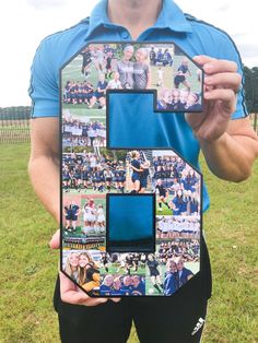 a man holding up a letter shaped like a photo collage