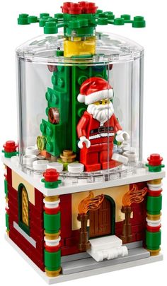 a lego christmas set with santa claus in the chimney