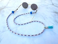 "Personalized Name & Colors Sunglass Lanyard, Trendy Sunglass Chain, Eyeglass Chain, Colorful Sunglasses Necklace, Eyeglass Strap A beautiful unique sunglass lanyard is designed by yours favourite colors. Let's fun and creative with your style!! You will never lost your favorite pair of shades again with these colorful, unique sunglass lanyard. All our sunglass lanyard are handmade with all our love. All high quality components are welly assembled into a truly unique designed by yours. 28\" in l Handmade Blue Glass Glasses Chains, Silver Glass Glasses Chains For Festival, Handmade Silver Glasses Chains For Beach, Silver Glass Glasses Chains For Summer, Purple Glass Glasses Chains As Gift, Adjustable Purple Glass Glasses Chains, Colorful Sunglasses, Sunglasses Necklace, Eyeglass Strap