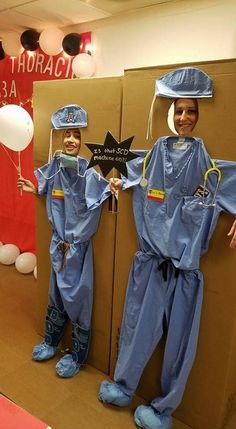 two children dressed up in costumes standing next to each other