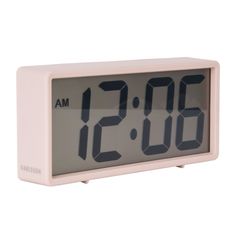 the alarm clock is white and has two different numbers on each side, as well as an hour