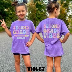 Custom Second Grade Vibes Shirt, Comfort Colors, Second Grade Kid Shirt, Back To School Shirt, Custom Name Shirt, First Day Of School Shirt Get your little one ready for a fantastic school year with our custom "Second Grade Vibes" shirt! Perfect for celebrating the start of a new grade, this shirt is designed to make your child feel special and excited about their second grade adventure. Crafted from high quality, soft cotton, this shirt offers maximum comfort and durability, perfect for an acti Purple Short Sleeve T-shirt For School Spirit, Cute Purple Short Sleeve Shirt, Summer School Spirit Short Sleeve Shirt, Multicolor Short Sleeve Shirt For School Spirit, Purple Short Sleeve School T-shirt, Purple Short Sleeve T-shirt For School, Casual Purple School Top, Purple Short Sleeve Shirt With Letter Print, Purple Short Sleeve Shirt With Text Print