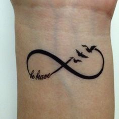 a tattoo on the wrist that says be brave with two birds flying over an infinite wave