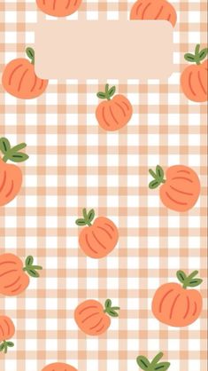 an orange and white checkered table cloth with tomatoes on it