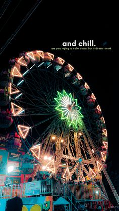 the ferris wheel is lit up at night