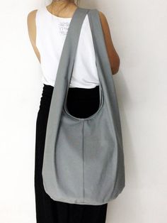 Handmade Canvas Bag Shoulder bag Sling bag Hobo bag Messenger Crossbody Purse - Gray. $11.99, via Etsy. Gray Large Capacity Hobo Shoulder Bag, Gray Hobo Shoulder Bag, Large Capacity Canvas Hobo Bag, Large Canvas Hobo Bag, Canvas Hobo Bag For Daily Use, Gray Hobo Shoulder Bag With Removable Pouch, Gray Hobo Bag With Removable Pouch, Hobo Canvas Bag With Removable Pouch, Large Capacity Hobo Canvas Bag