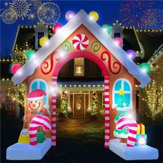 an inflatable gingerbread house with christmas lights and candy canes on it