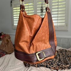 Nwot Bought In Italy! Brown Leather Purse From Italy. Adjustable Strap. Buckle Detail On The Front. Hidden Zipper On The Side With A Small Pocket. Slight Water Damage On The Front. (84) Italian Leather Purse, Brown Leather Purse, Brown Purse, Water Damage, Leather Purse, Italian Leather, Hidden Zipper, Leather Purses, Brown Leather