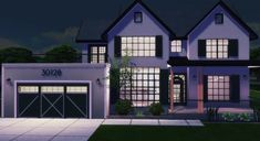 a three story house with two garages at night