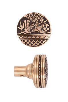 an antique brass knob with decorative designs on it