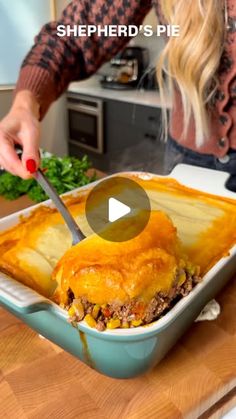 a woman cutting into a casserole dish with a knife