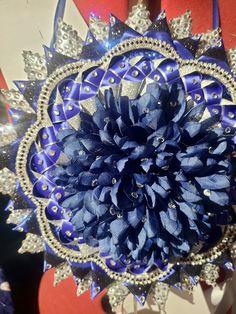 a large blue flower sitting on top of a table