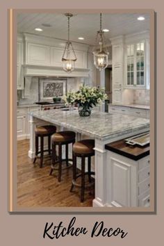 a large kitchen with an island in the middle of it and stools at the end