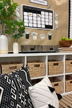 a white table topped with baskets filled with plants