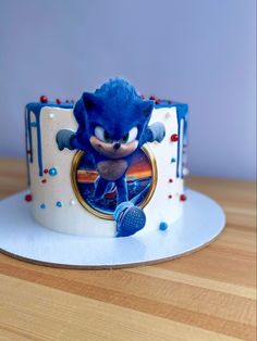 a sonic the hedgehog birthday cake with sprinkles and blue icing