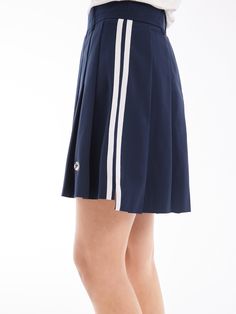 Details: Girly Pleated Skirt In NavyBuilt-in shorts for a discreet summer lookStriped webbing at the side for a vintage college look. Materials & Care: Fabric: Polyester 100%.Lining: nylon 92.4 %Spandex 7.6 % Hand wash | Dry clean Do not bleach Size & Fit: Model is 5'7", Bust 32, Waist 24, Hips 35, wearing a size S Item #: SN2SK10 Stretch Tennis Skirt, Short Tennis Skirt For School In Summer, Sporty Pleated Mini Skirt For Summer, Sporty Mini Pleated Skirt For Summer, Casual Knee-length Tennis Skirt For Summer, Casual Knee-length Summer Tennis Skirt, Preppy Stretch Skort For Summer, Knee-length Casual Tennis Skirt, Summer School Shorts With Lined Skirt