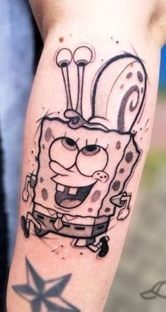 spongebob tattoo on the left arm