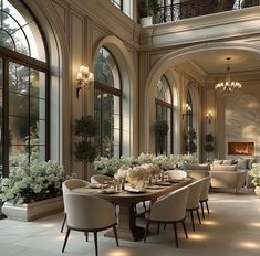 an elegant dining room with chandeliers and large windows