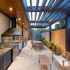 an outdoor kitchen and dining area is shown