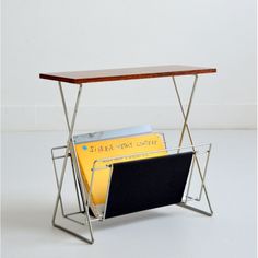 a magazine rack holding magazines and folders