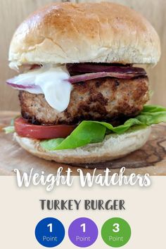 the weight watchers turkey burger is shown on a cutting board with three point points