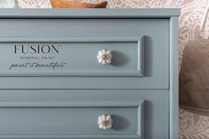 New for 2021, Paisley by Fusion Mineral Paint is an ode to our heritage. Inspired by the rivers edge that runs through the beautiful town of Paisley, Scotland; this multi tone blue evokes a whimsical feeling. Pair with Little Whale for a neutral tone-on-tone backdrop, or Rose Water for a charming twist. This truly inspiring blue reveals its softness when compared to our more pure and bright Champness. When paired next to a neutral grey like Pebble, Paisley shows its cool tone and its depth of co Paisley Scotland, Rivers Edge, Furniture Remodeling, Mineral Fusion, Fusion Paint, Beautiful Town, River Edge, Large Sideboard, Furniture Paint