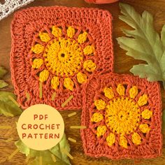 two crocheted coasters with leaves on the table